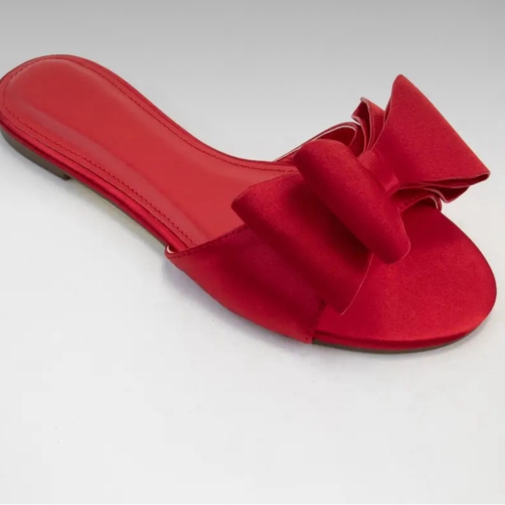 Red slip on for women with bow. Brand new. Flats.
Lilibabes 
Multiple sizes